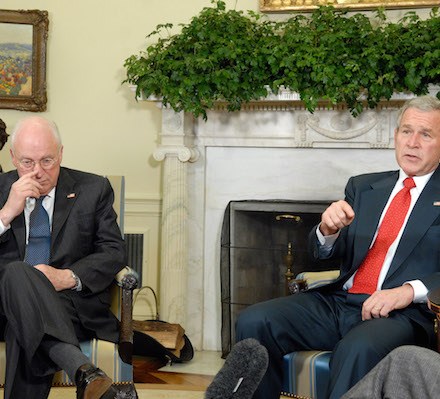 WASHINGTON - FEBRUARY 15:  (AFP OUT) Vice President Dick Cheney (L) listens as U.S. President George W. Bush speaks to the media after meeting with the Bicameral Republican Leadership in the Oval Office of the White House February 15, 2008 in Washington, DC. Republican Congressional leaders met with President George W. Bush and Vice President Dick Cheney to discuss the Protect America Act 2007 which is set to expire February 16 if the House does not pass the legislation.  (Photo by Roger L. Wollenberg-Pool/Getty Images)