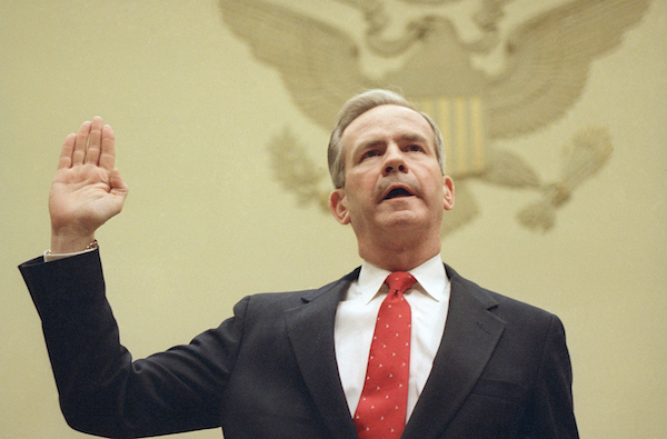 Former National Security Adviser Robert McFarlane is swo in on Capitol Hill before the House Foreign Affairs Committee in Washington, Dec. 8, 1986. McFarlane testifies before the committee that President Reagan gave his approval for an