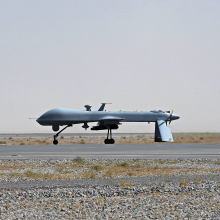 FILE - In this June 13, 2010, file photo a U.S. Predator unmanned drone armed with a missile stands on the tarmac of Kandahar military airport in Afghanistan. Hunting al-Qaida targets from Pakistan to Afghanistan, Yemen to Somalia, the fleet of U.S. armed Predator and Reaper drones that killed two American members of al-Qaida in Yemen Friday, Sept. 30, 2011, are the night stalkers of the expanded U.S. war on terrorists.  (AP Photo/Massoud Hossaini, Pool, File)