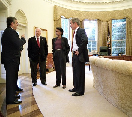 President George W. Bush meets with Vice President Dick Cheney, CIA Director George Tenet and National Security Advisor Condoleezza Rice in the Oval Office after informing the nation that air strikes were made against the Taliban Sunday, October 7, 2001WHITE HOUSE PHOTO BY ERIC DRAPER