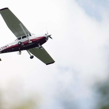 In this photo taken May 26, 2015, a small plane flies near Manassas Regional Airport in Manassas, Va. The plane is among a fleet of surveillance aircraft by the FBI, which are primarily used to target suspects under federal investigation. Such planes are capable of taking video of the ground, and some _ in rare occasions _ can sweep up certain identifying cellphone data. (AP Photo/Andrew Harnik)