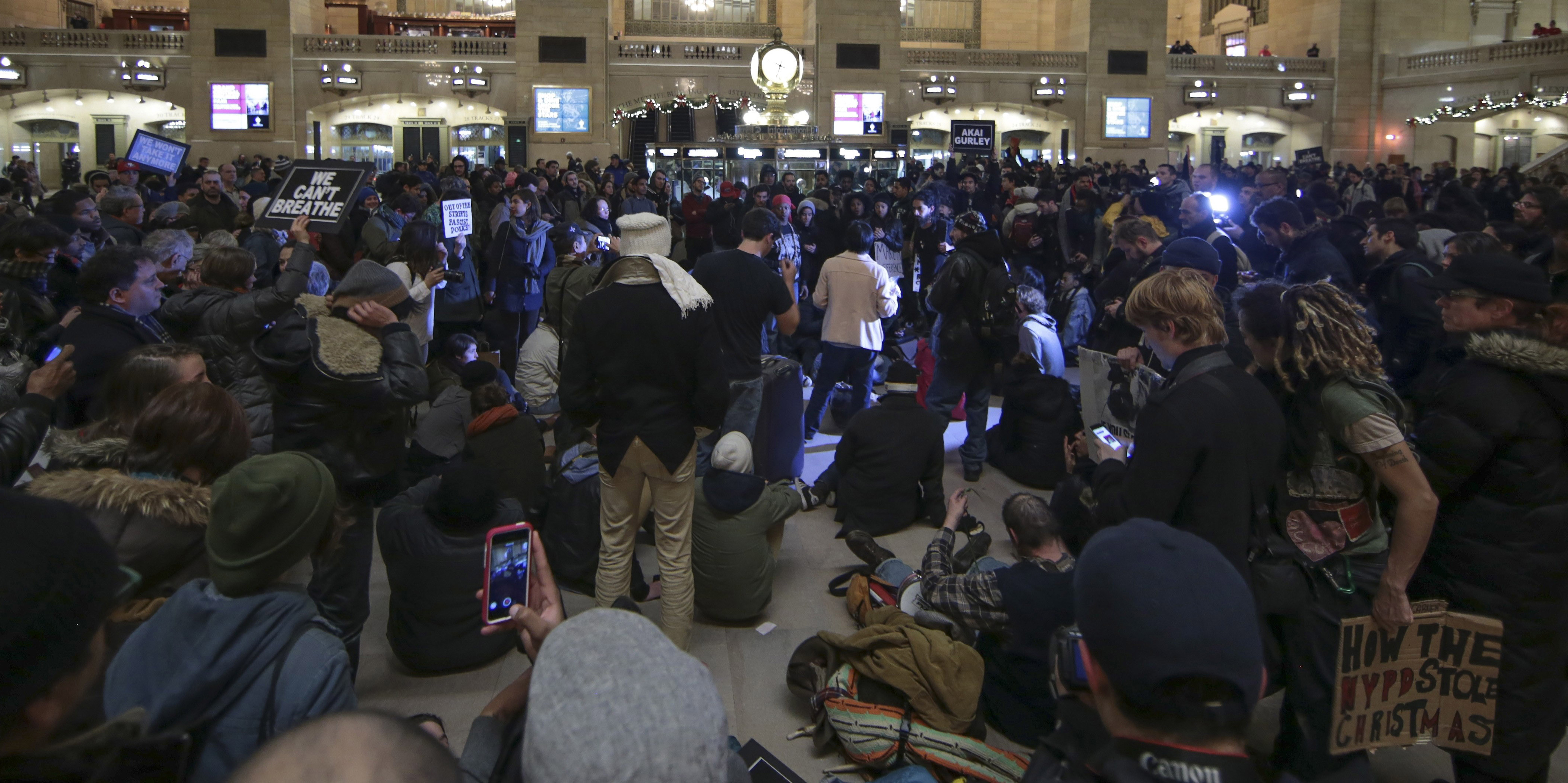 NEW YORK, NY - DECEMBER 7: Demonstrators stage a Die-In in Grand Central Terminal protesting a grand jury's decision not to indict a police officer involved in the chokehold death of Eric Garner in July on December 7, 2014 in New York City. Protests are being staged nationwide after grand juries investigating the deaths of Michael Brown in Ferguson, Missouri and Eric Garner in New York failed to indict the police officers involved in both incidents. (Photo by Bilgin S. Sasmaz/Anadolu Agency/Getty Images)