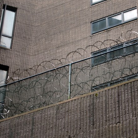 NEW YORK - JUNE 09:  Razor wire hangs on a railing at the Metropolitan Correctional Center June 9, 2009 in New York City.  Suspected terrorist Ahmed Khalfan Ghailani, who had been held at Guantanamo Bay since September 2006, has been tranferred to Metropolitan Correctional Center to face criminal charges in New York.  Disgraced financier Bernard Madoff is also being held at the facility.  (Photo by Chris Hondros/Getty Images)