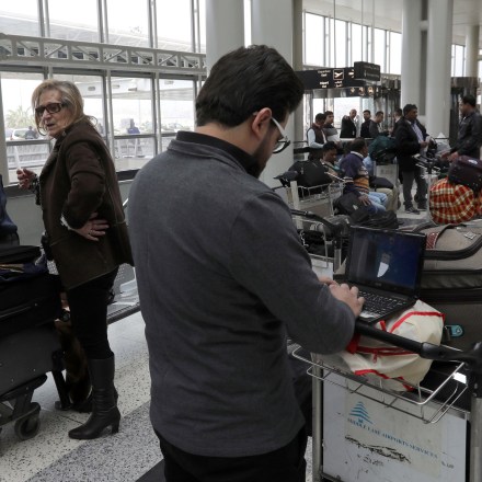 A Syrian passenger travelling to the United States through Amman types on his laptop before entering Beirut international airport's departure lounge on March 22,2017.Hours after the US government warned that extremists plan to target passenger jets with bombs hidden in electronic devices, and banned carrying them in cabins on flights from 10 airports in eight countries in the Middle East and North Africa, Britain tightened airline security on flights from the same region, banning laptops and tablet computers from the plane cabin. / AFP PHOTO / ANWAR AMRO (Photo credit should read ANWAR AMRO/AFP/Getty Images)