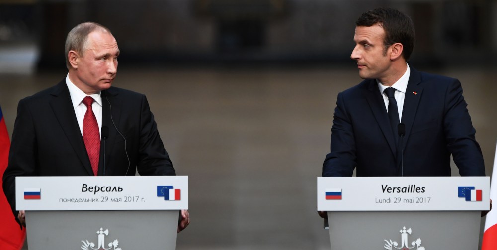As Putin Looks On, Macron Says Russian State News Channels Spread Lies ...