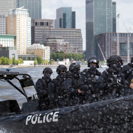 Armed Metropolitan Police counter terrorism officers take part in an exercise on the River Thames in London, Wednesday Aug. 3, 2016. London's police force is putting more armed officers on the streets 'to protect against the threat of terrorism.'' The increase in the number of officers follows attacks in France, Belgium and Germany.  (Stefan Rousseau/Pool Photo via AP)