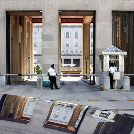 Mandatory Credit: Photo by Jacquelyn Martin/AP/REX/Shutterstock (9692541a)Security works at the Department of Justice as the building is reflected in the hood of a car, ahead of a group meeting about the Trump Russia probe in Washington. Among the people expected to meet at the request of President Donald Trump are House Permanent Select Committee on Intelligence Chairman Devin Nunes, House Committee on Oversight and Government Reform Chairman Trey Gowdy, FBI Director Christopher Wray, Director of National Intelligence Dan Coats, Principal Deputy Assistant Attorney General for the National Security Division Ed O'Callaghan, and White House Chief of Staff John KellyTrump Russia Probe, Washington, USA - 24 May 2018