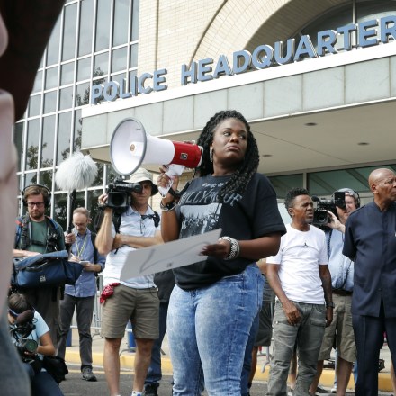 FILE - In this Sept. 17, 2017 file photo, Cori Bush speaks on a bullhorn to protesters outside the St. Louis Police Department headquarters in St. Louis. Few members of Congress are more entrenched than William Lacy Clay of St. Louis, but Bush, a once-homeless woman spurred to activism in Ferguson believes she could be the next Democrat to pull off a big primary upset. Bush watched in June as Alexandria Ocasio-Cortez shocked the political establishment by beating 10-term Rep. Joseph Crowley in the New York Democratic primary. Bush is optimistic heading into Missouri's Aug. 7 primary. (AP Photo/Jeff Roberson File)