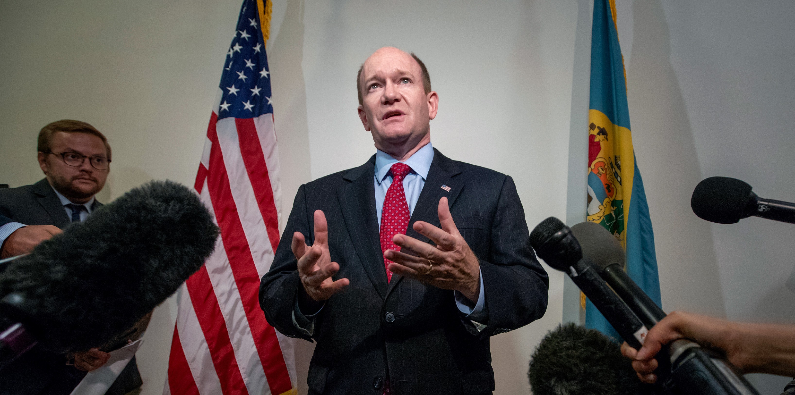 Sen. Chris Coons, D-Del., speaks to reporters after his meeting with President Donald Trump's Supreme Court nominee, Judge Brett Kavanaugh, on Capitol Hill in Washington, Thursday, Aug. 23, 2018. Sen. Coons, a member of the Senate Judiciary Committee which will oversee Kavanaugh's confirmation, says he does not think the committee should go forward with the scheduled September 4th hearings. (AP Photo/J. Scott Applewhite)