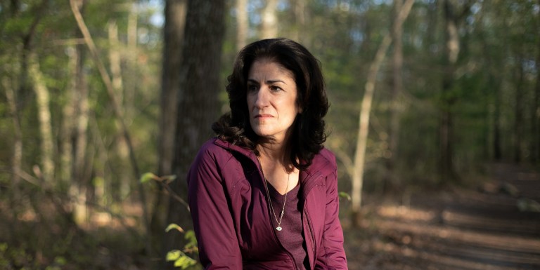 Mansfield, MA -- 05/09/2019 -- Ellen Gallagher poses for a portrait during a walk in a park near her home on May 8, 2019, in Mansfield, Massachusetts. She walked through this park almost every day over the last 4.5 years, while engaged in the process of bringing the information about immigration detainment to light. She would often sit on a rock during the walk to think, process, and sometimes pray about the issue, and the part she plays in the situation. (Kayana Szymczak for The Intercept)