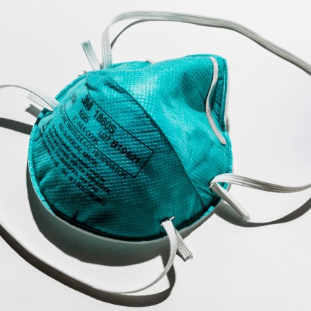 The N-95 mask is the first and most basic requirement for health-care workers to protect themselves from being infected by a COVID-19 positive patient. The virus is passed on by droplets (or aerosols) expelled during coughing or other times by the patient. The mask must fit the health worker snugly to be effective and different sizes fit different face shapes. The biggest difference between the N-95 and other face masks is the material it is made of and how that material is able to filter out the virus carrying droplets or aerosols. The material appears more like densely-woven layered cloth than in the paper-like masks for general use.