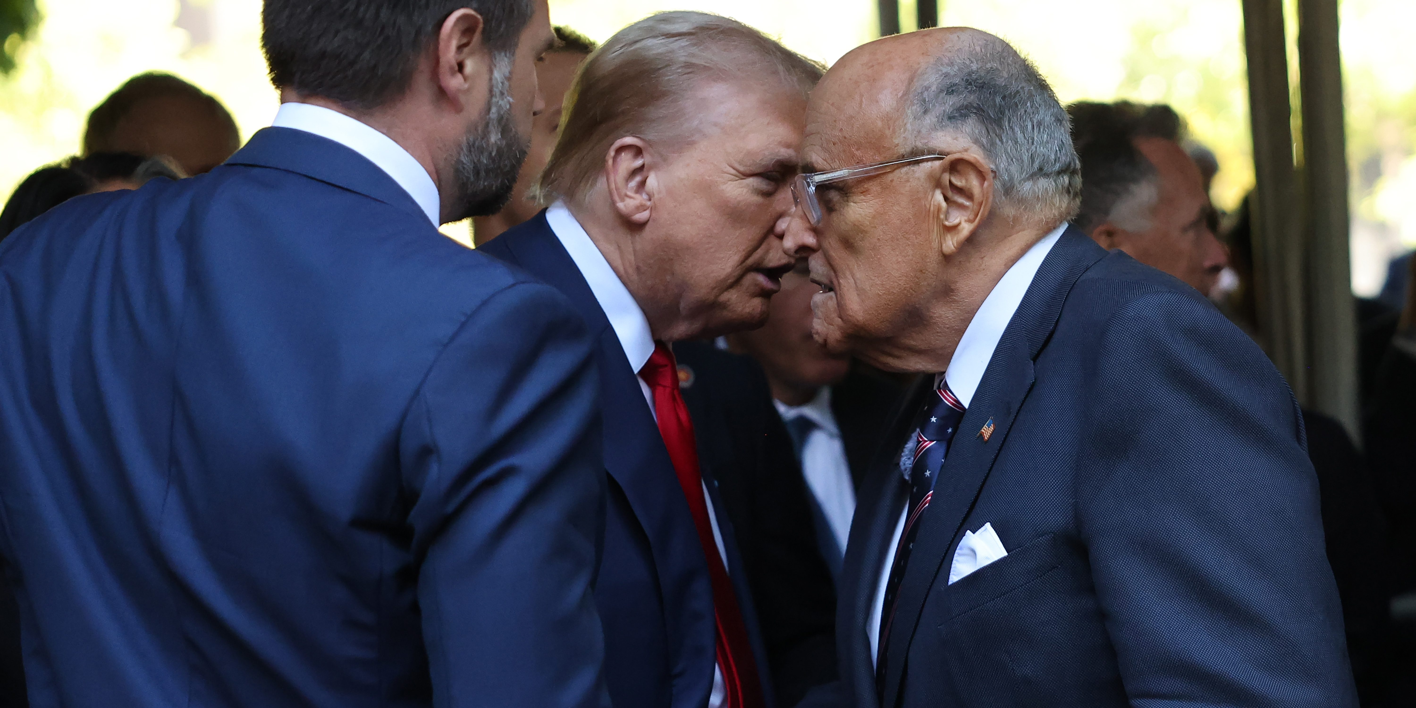 Former U.S. President Donald Trump and former NYC Mayor Rudy Giuliani shake hands as they attend the annual 9/11 Commemoration Ceremony at the National 9/11 Memorial and Museum on September 11, 2024 in New York City.
