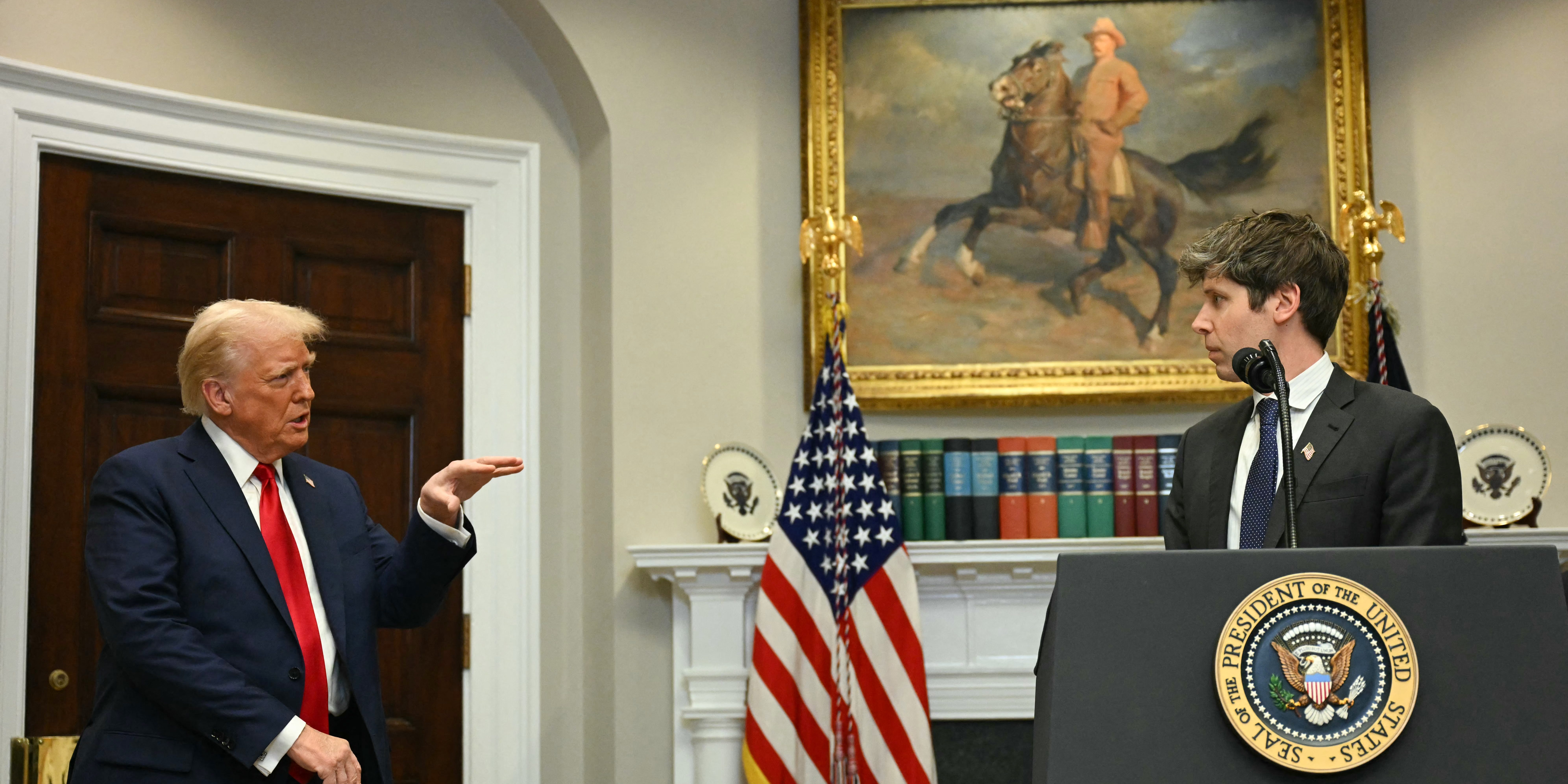 US President Trump gestures as CEO of Open AI Sam Altman speaks in the Roosevelt Room at the White House on January 21, 2025, in Washington, DC. (Photo by Jim WATSON / AFP) (Photo by JIM WATSON/AFP via Getty Images)