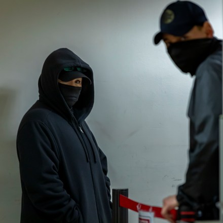 Masked federal agents patrol the halls of immigration court at the Jacob K. Javitz Federal Building.