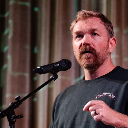 OGUNQUIT, MAINE - OCTOBER 22: U.S. senatorial candidate from Maine Graham Platner speaks at a town hall at the Leavitt Theater on October 22, 2025 in Ogunquit, Maine. Platner, a veteran of the U.S. Marines and an oyster farmer, is running for the seat held by Sen. Susan Collins (R-ME).