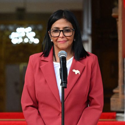 US Interior Secretary Doug Burgum speaks alongside Venezuela's interim president, Delcy Rodriguez, after their meeting at the Miraflores Presidential Palace in Caracas on March 4, 2026. US Interior Secretary Doug Burgum on March 4, 2026,  became the latest senior Trump administration official to visit Venezuela, as Washington pushes to ramp up oil and mineral production in the country. (Photo by Federico PARRA / AFP via Getty Images)