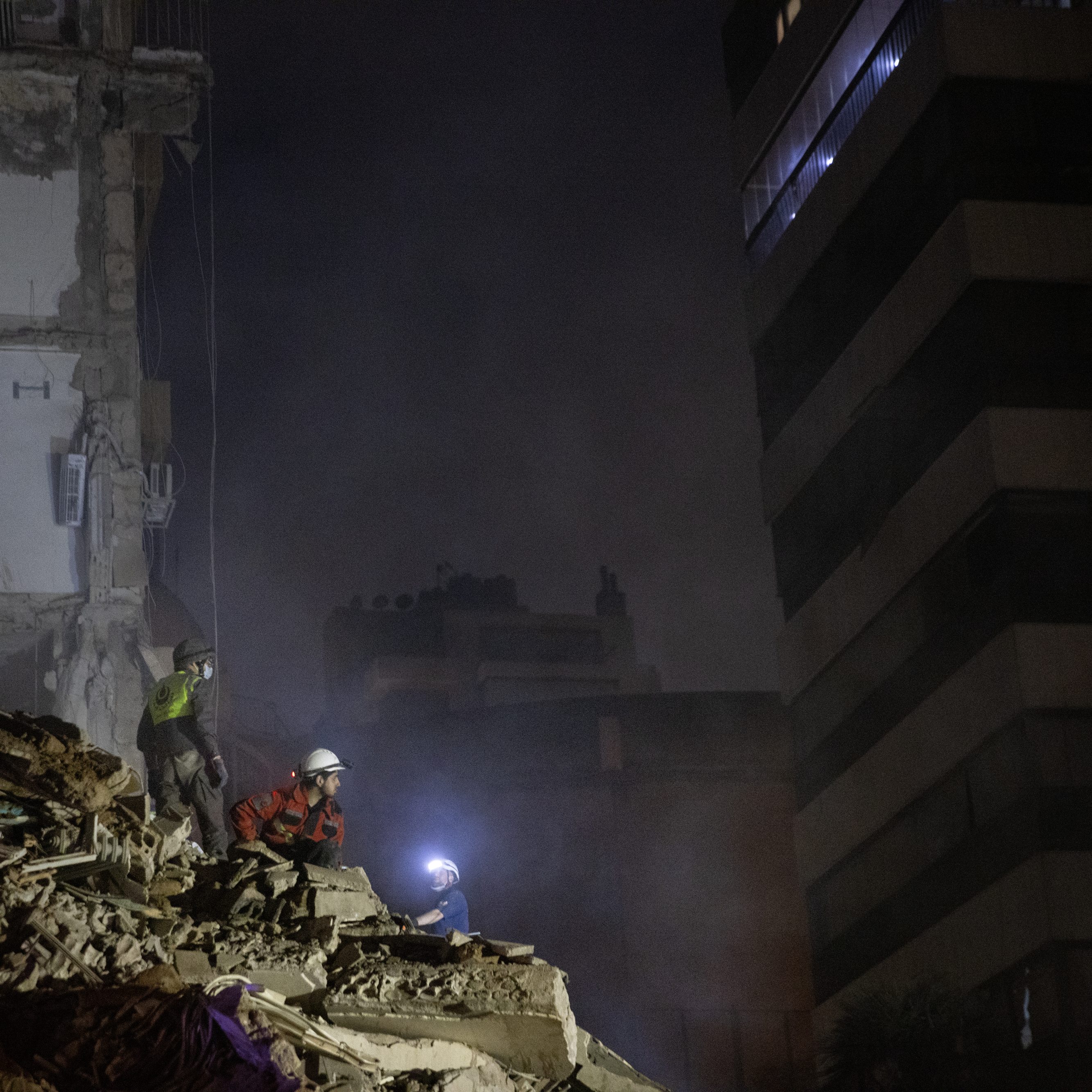 BEIRUT, LEBANON - APRIL 8: Rescue workers search the rubble for survivors and casualties after an Israeli attack targeted a residential building on April 8, 2026 in Beirut, Lebanon. Israel has stepped-up its attacks on Lebanon following President Donald Trump's announcement of a two-week ceasefire agreement between the US and Iran. Israel says it will observe the ceasefire with Iran but insists Lebanon was not included in the deal, and has since launched the "largest coordinated strike" on Hezbollah targets since the resumption of the cross-border war on March 2. Iran and Pakistan - which has been coordinating peace talks - have said that the ceasefire included Lebanon, while US President Donald Trump has said Lebanon is a "separate skirmish," and not part of the deal. (Photo by Daniel Carde/Getty Images)