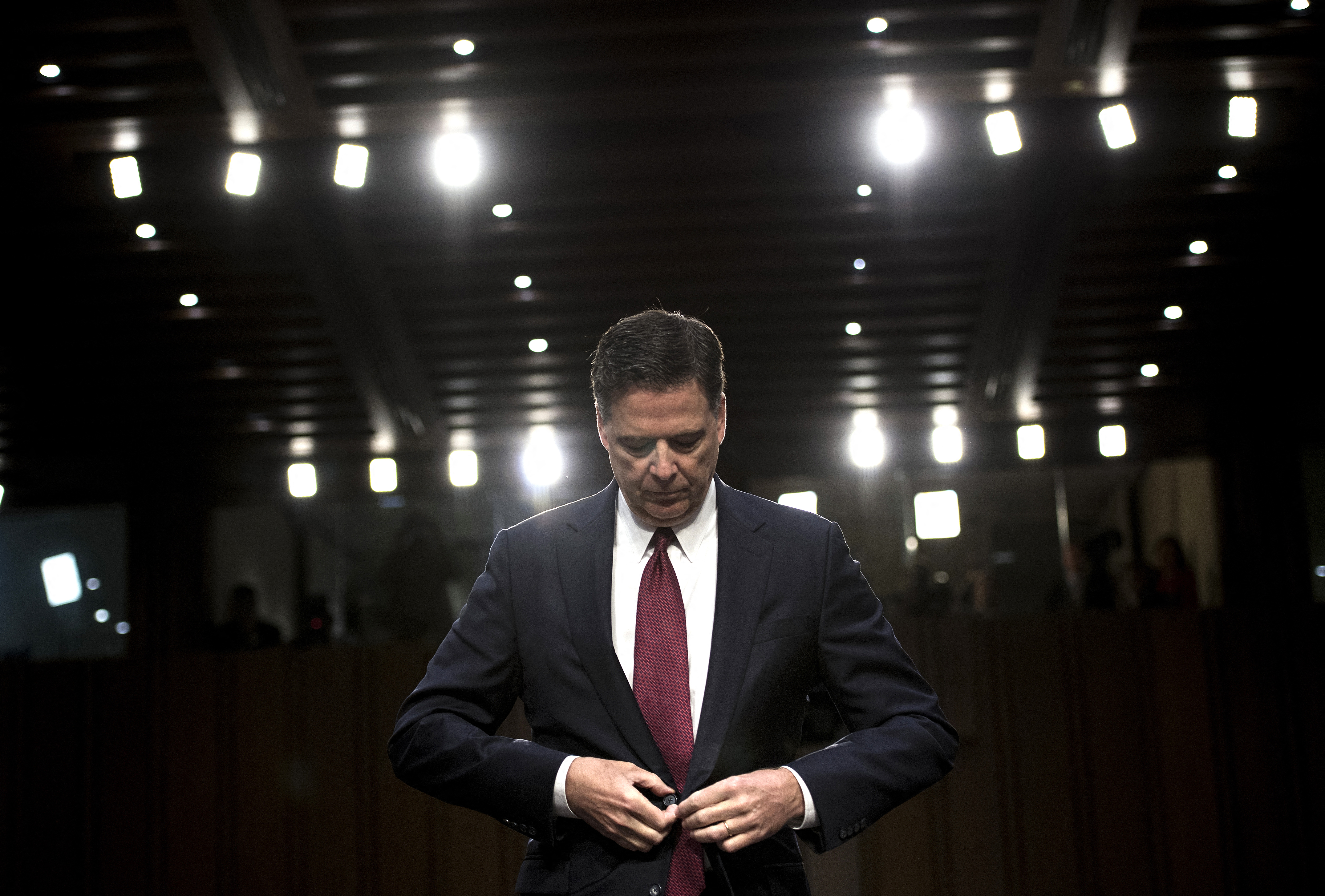 Ousted FBI director James Comey listens during a hearing before the Senate Select Committee on Intelligence on Capitol Hill June 8, 2017 in Washington, DC. Fired FBI director James Comey took the stand Thursday in a crucial Senate hearing, repeating explosive allegations that President Donald Trump badgered him over the highly sensitive investigation Russia's meddling in the 2016 election. (Photo by Brendan Smialowski / AFP) (Photo by BRENDAN SMIALOWSKI/AFP via Getty Images)