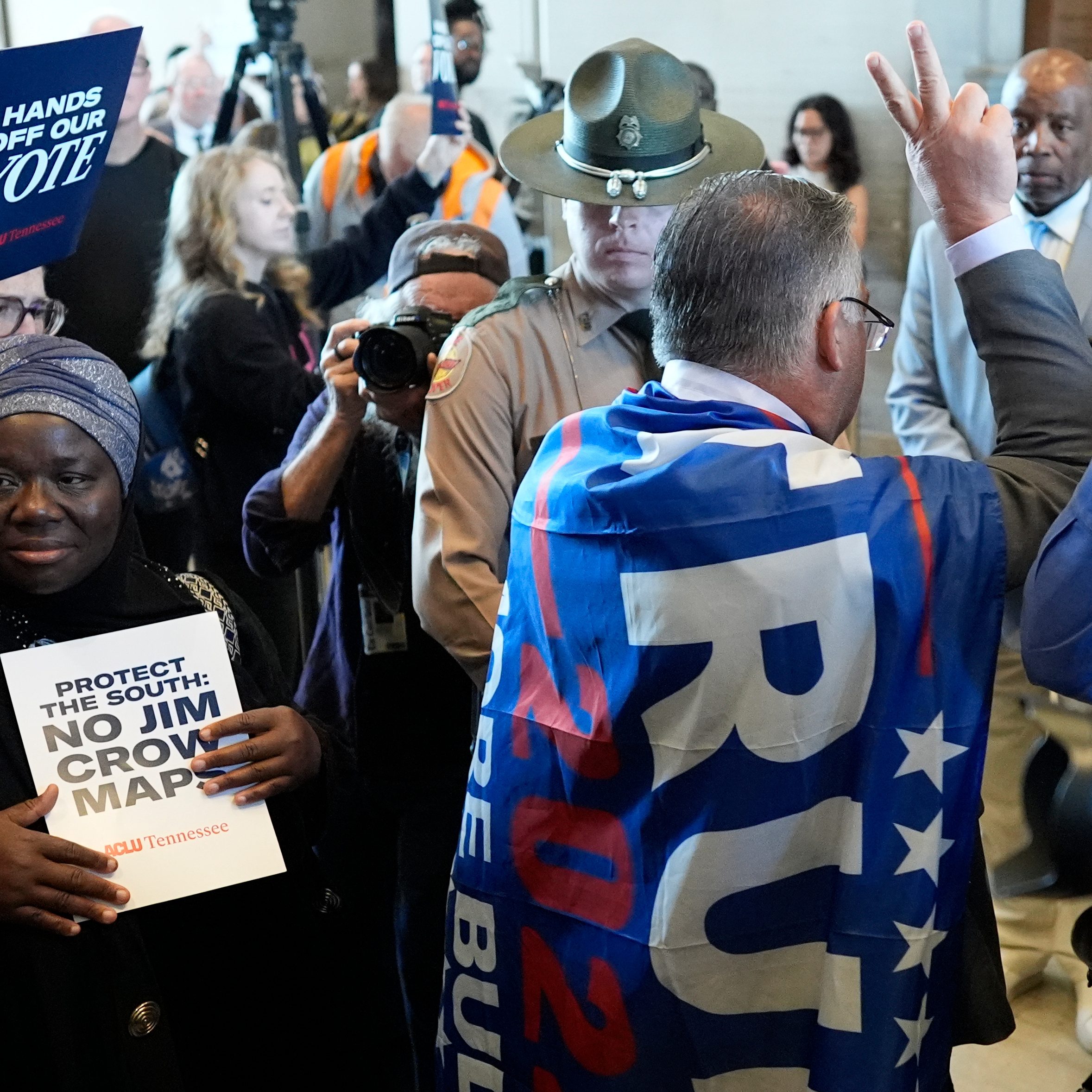 Rep. Todd Warner, R-Chapel Hill, arrives to the House chamber wearing a Trump flag for a special session of the state legislature to redraw U.S. Congressional voting maps Thursday, May 7, 2026, in Nashville, Tenn. (AP Photo/George Walker IV)