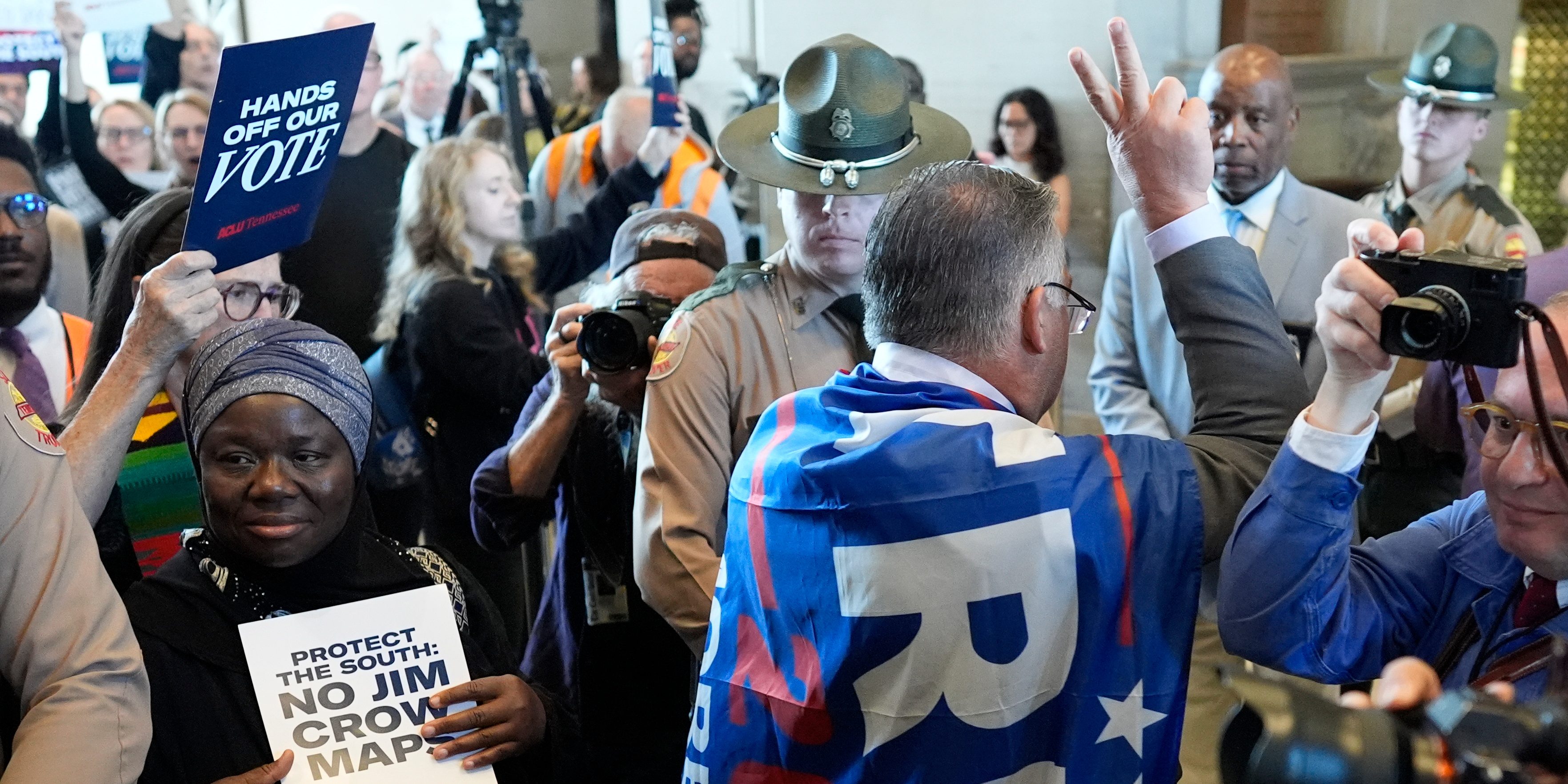 Rep. Todd Warner, R-Chapel Hill, arrives to the House chamber wearing a Trump flag for a special session of the state legislature to redraw U.S. Congressional voting maps Thursday, May 7, 2026, in Nashville, Tenn. (AP Photo/George Walker IV)