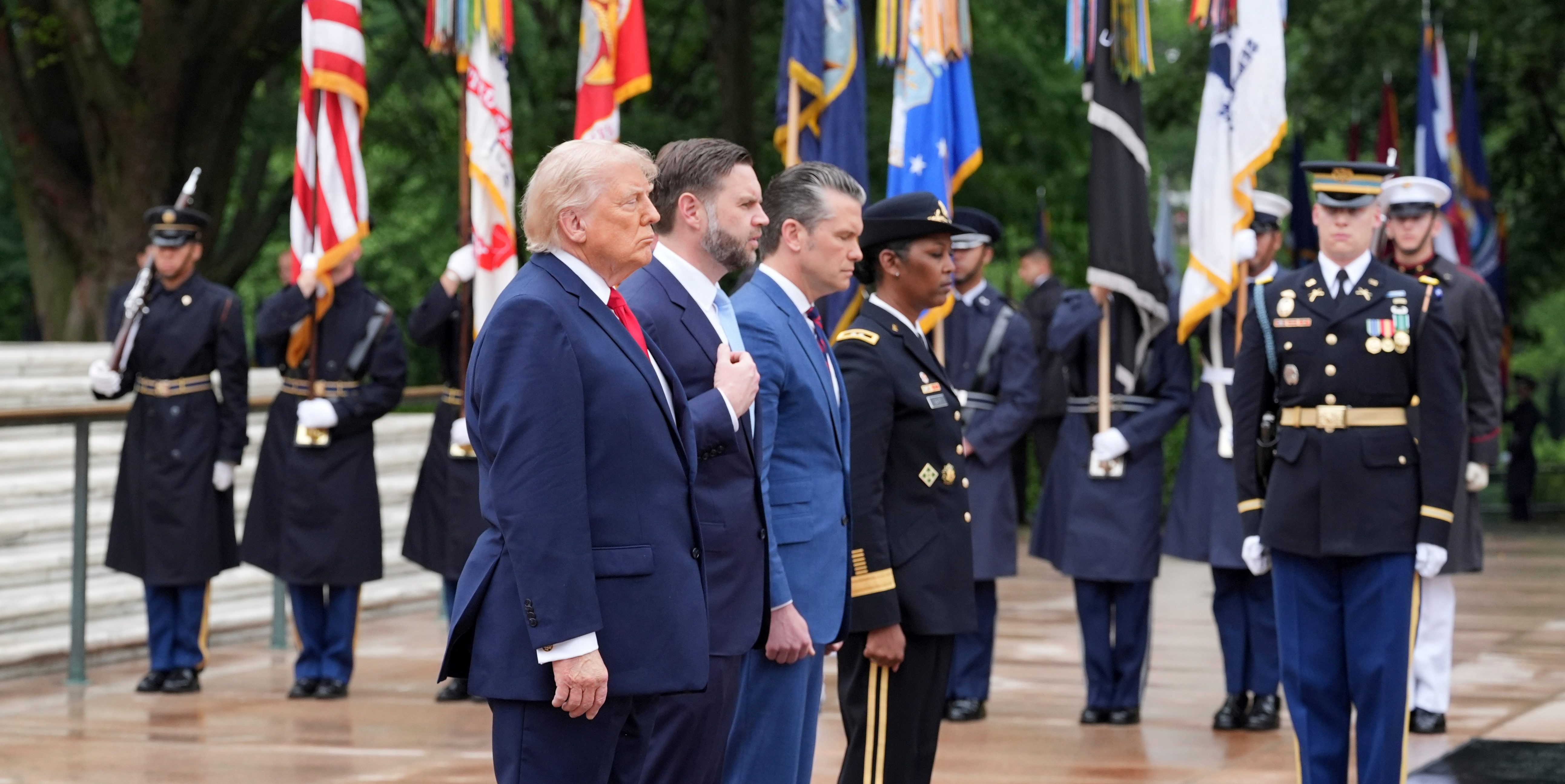 President Donald Trump, stands alongside Vice President JD Vance, Secretary of Defense Pete Hegseth at the Tomb of the Unknown Soldier in Arlington National Cemetery on Memorial Day, Monday, May 25, 2026, in Arlington, Va.