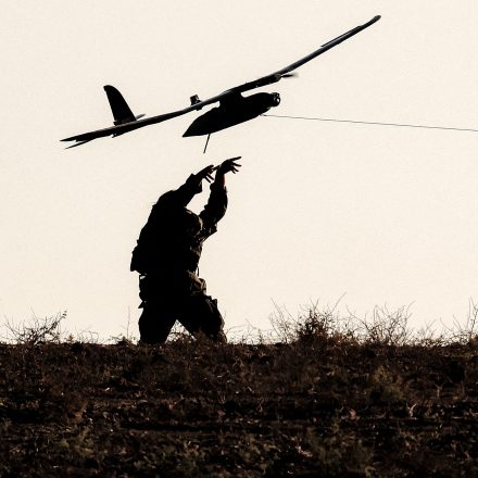 TOPSHOT - An Israeli army soldier launches an Elbit Skylark miniature unmanned aerial vehicle (mini UAV) used for surveillance, from an army deployment area near the border with the Gaza Strip in southern Israel on September 30, 2025. The US president on September 29 laid out a plan to end the war in Gaza and Israeli Prime Minister Benjamin Netanyahu said he backed the proposal. The two allies demanded approval by Hamas, whose October 7, 2023 attack triggered a massive Israeli offensive, with Netanyahu warning he will "finish the job" if Hamas says no. (Photo by Jack GUEZ / AFP) (Photo by JACK GUEZ/AFP via Getty Images)