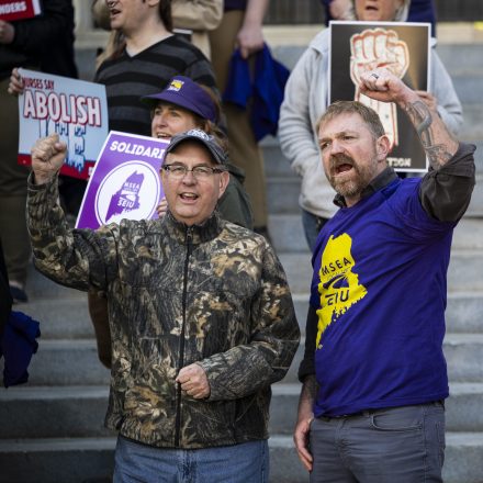 PORTLAND, MAINE - MAY 1: U.S. House candidate from Maine Matt Dunlap (L) and U.S. Senate candidate from Maine Graham Platner (C) cheer during a May Day rally organized by local unions, on May 1, 2026 outside City Hall in Portland, Maine. Platner joined the Maine Service Employees Association SEIU 1989 demonstration to honor the labor rights movement as he campaigns to be the Democratic nominee ahead of the June primary. (Photo by Graeme Sloan/Getty Images)