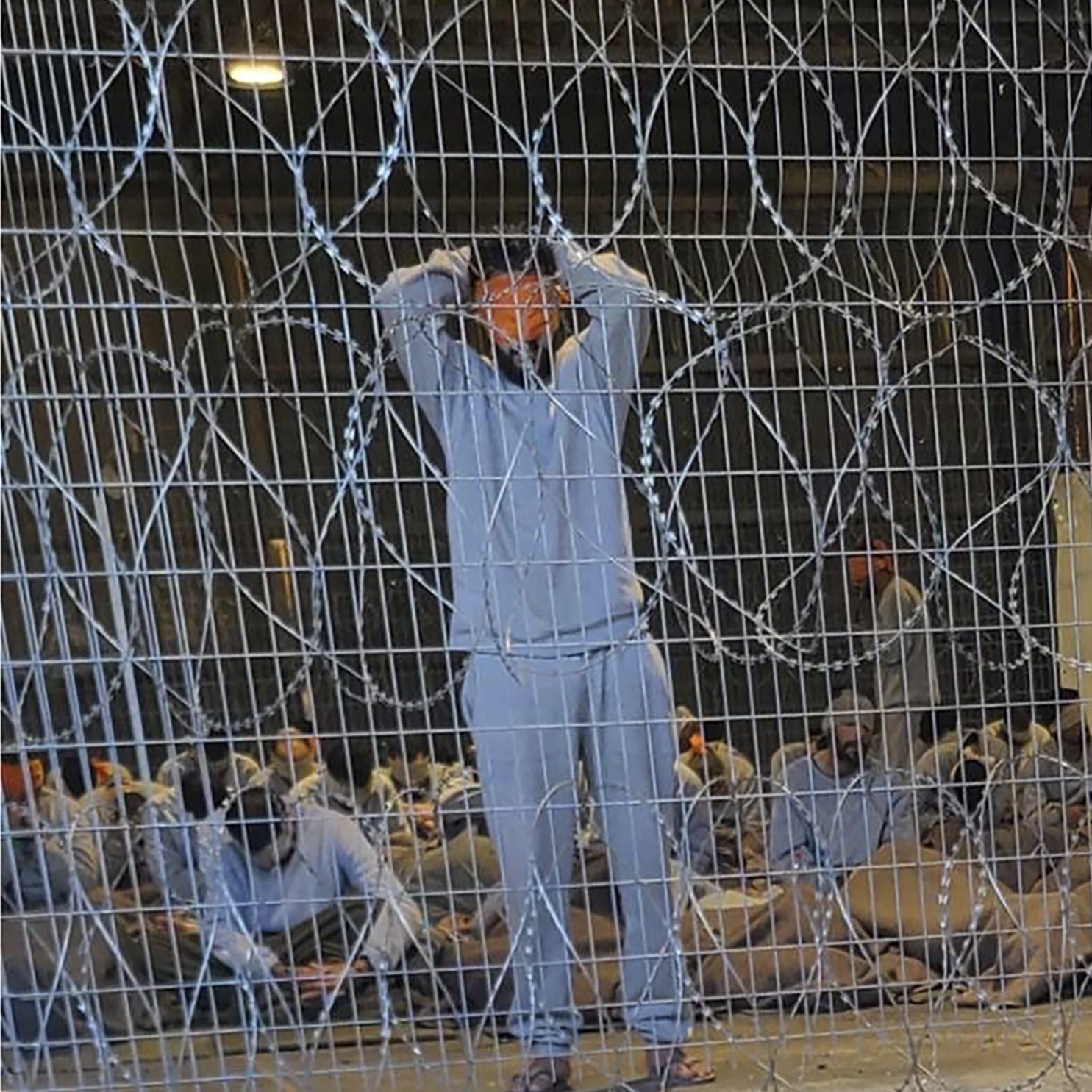 This undated photo from Winter 2023 provided by Breaking The Silence, a whistleblower group of former Israeli soldiers, shows blindfolded Palestinian prisoners captured in the Gaza Strip by Israeli forces at a detention facility on the Sde Teiman military base in southern Israel. (Breaking The Silence via AP)