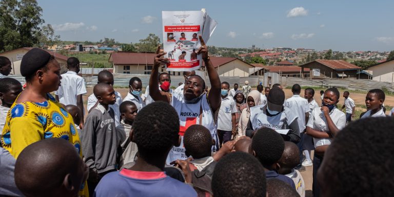 Vanny Birungi, a Red Cross volunteer, speaks to people during a public sensitisation campaign amid the Ebola outbreak in Bunia, Congo, Monday, May 25, 2026.