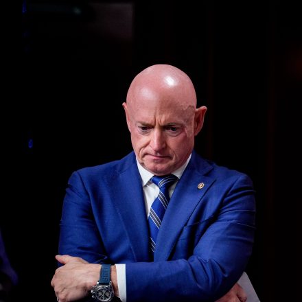 WASHINGTON, DC - JUNE 17: Sen. Mark Kelly (D-AZ) stands next to a poster that reads "Trump Hostage Note" during a news conference on Capitol Hill on June 17, 2026 in Washington, DC. U.S. President Donald Trump has withdrawn Jay Clayton's nomination to serve as Director of National Intelligence, reaffirmed his support for keeping Bill Pulte in the acting role, and pushed for the inclusion of the SAVE Act in any extension of the Foreign Intelligence Surveillance Act (FISA). (Photo by Andrew Harnik/Getty Images)