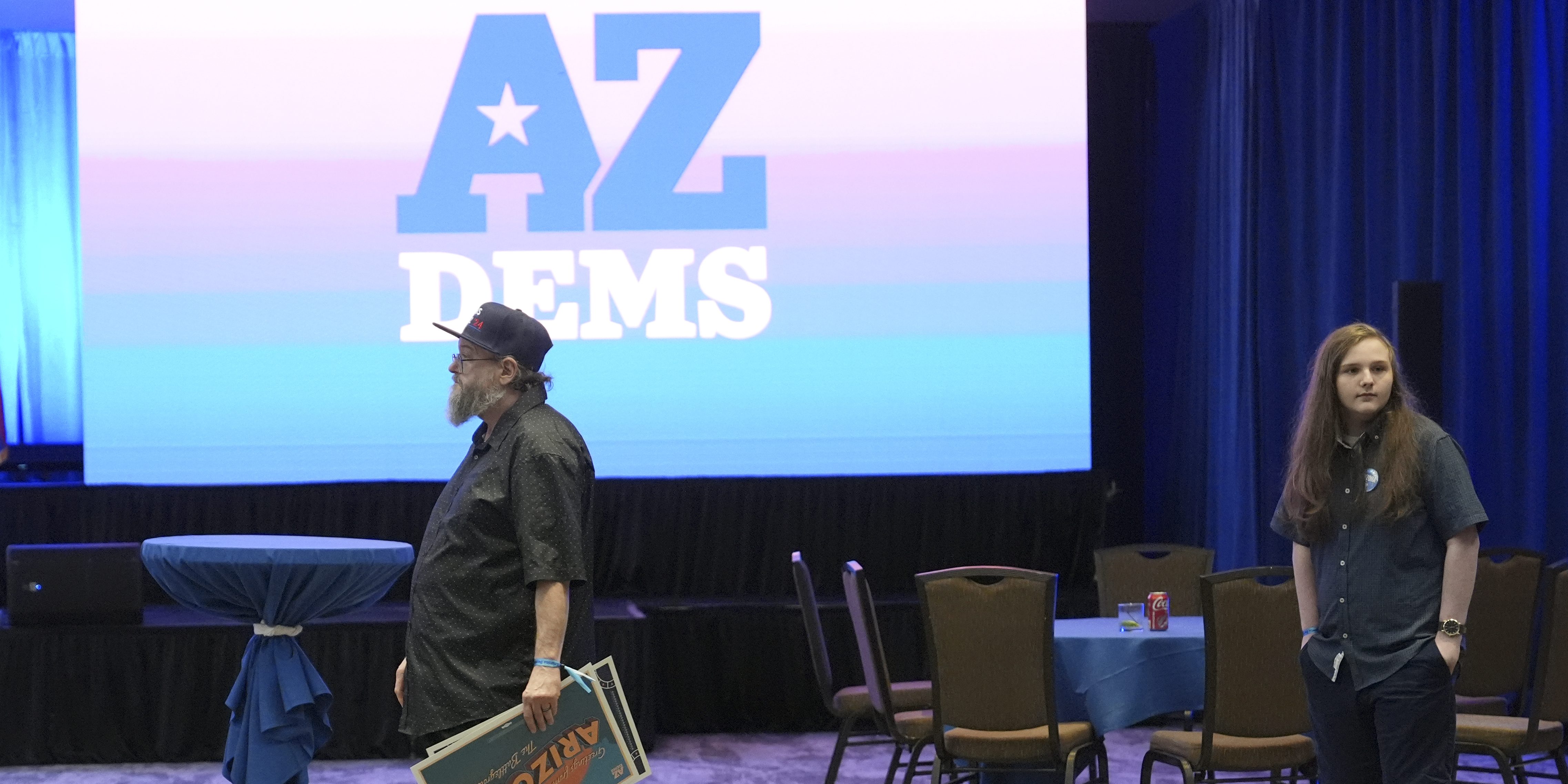 Arizona Democratic party supporters walk to the exit after attending a watch party on election night Tuesday, Nov. 5, 2024, in Phoenix. (AP Photo/Ross D. Franklin)