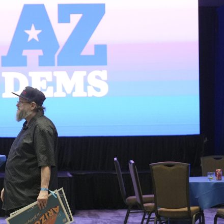 Arizona Democratic party supporters walk to the exit after attending a watch party on election night Tuesday, Nov. 5, 2024, in Phoenix. (AP Photo/Ross D. Franklin)