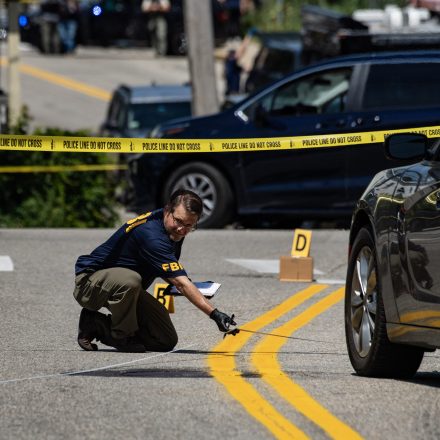 FBI investigators work the scene of an alleged ICE involved shooting in Biddeford, Maine, on July 13, 2026. A person was killed Monday in a shooting involving Immigration and Customs Enforcement (ICE) agents in the northern US state of Maine, an official said.  The incident comes after an ICE agent last week shot dead a Mexican man during an operation in Houston, Texas. Authorities alleged that he tried to run over a federal officer, a claim denied by witnesses. (Photo by Joseph Prezioso / AFP via Getty Images)