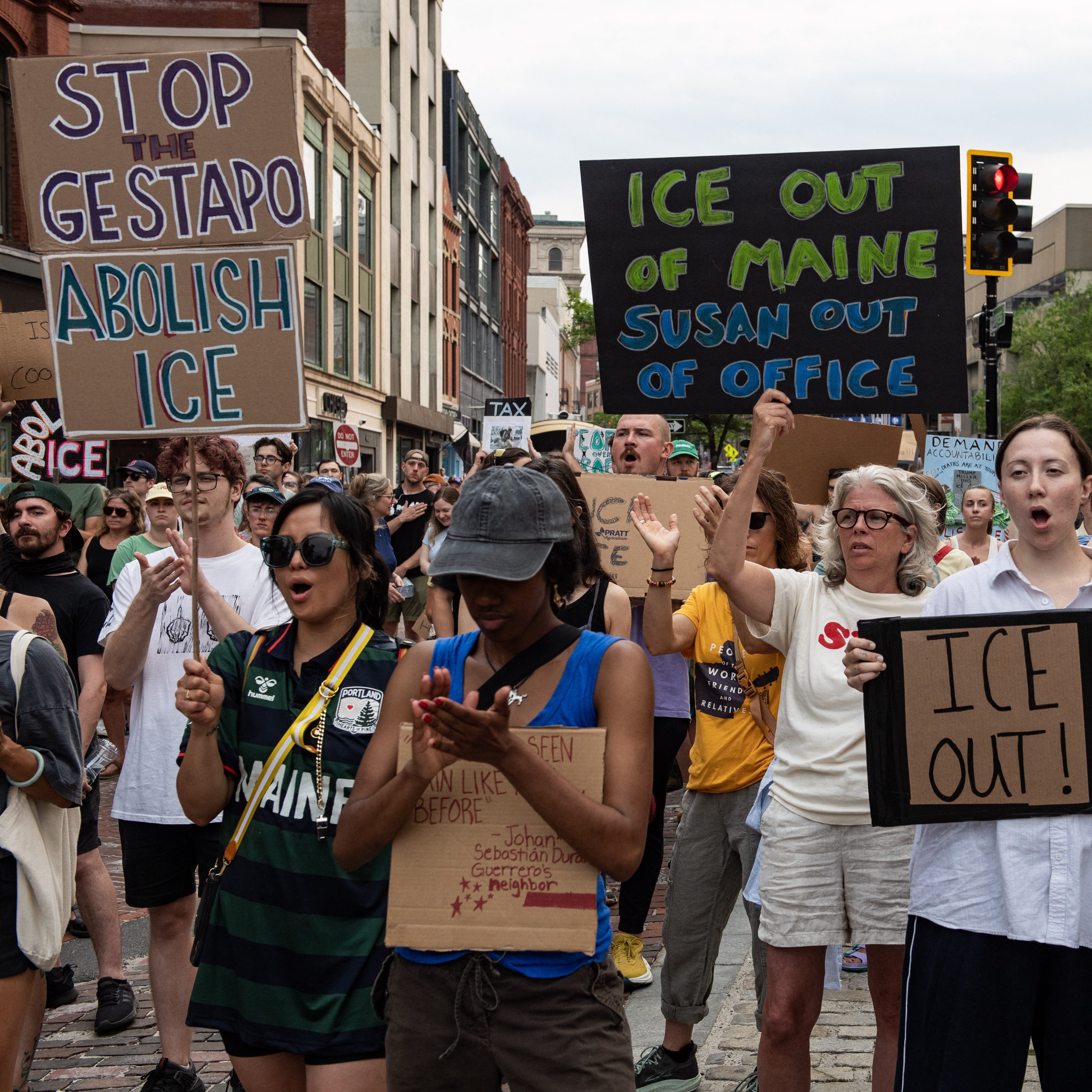 Demonstrators protest the killing of a local 26-year-old man by a federal officer at Monument Square in Portland, Maine, on July 14, 2026. A US immigration officer on July 13, fatally shot a man identified by rights groups as a 26-year-old Colombian, an incident likely to fuel criticism of President Donald Trump's deportation drive. The shooting happened in Biddeford, a town of 22,000 people in the northern state of Maine, and comes a week after an Immigration and Customs Enforcement (ICE) agent shot dead a Mexican man in Texas. (Photo by JOSEPH PREZIOSO / AFP via Getty Images)