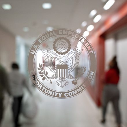 The Equal Employment Opportunity Commission (EEOC) seal is displayed on a window at the headquarters in Washington, D.C., U.S., on Tuesday, Feb. 18, 2020. The Trump administration wants to cut fiscal year 2021 spending on the Labor Department, National Labor Relations Board, and EEOC, reviving previous belt-tightening bids that have not been approved by Congress. Photographer: Andrew Harrer/Bloomberg via Getty Images