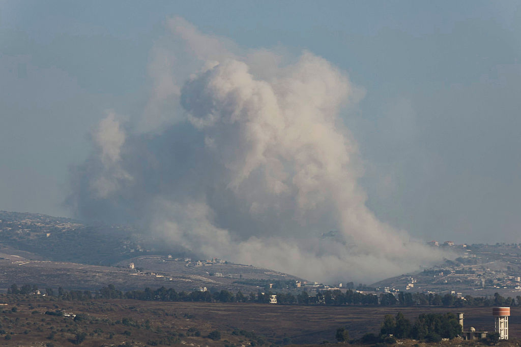 This picture taken from the southern Lebanese village of Zawtar al-Gharbiyah shows smoke billowing from the site of an Israeli controlled explosion in the village of Bani Hayyan on August 13, 2026. Lebanese Prime Minister Nawaf Salam on August 12 condemned Israel's "systematic destruction" in the country's south as a violation of international law, as Israel's defence minister said its military was "destroying all the houses" there. (Photo by Ammar Ammar / AFP via Getty Images) /