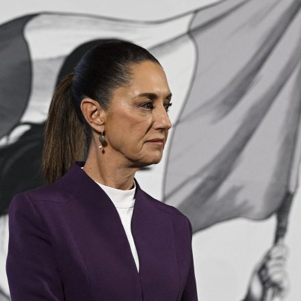 TOPSHOT - Mexico's President Claudia Sheinbaum gestures while announcing that Mexico will hit back at US President Donald Trump's tariffs with retaliatory duties of its own as there was "no reason or justification" for his decision, duing her news conference at the National Palace in Mexico City, on March 4, 2025. Stinging US tariffs on Canadian and Mexican goods came into effect as a deadline to avert President Donald Trump's levies passed without the nations striking a deal -- a move set to snarl supply chains. (Photo by Alfredo ESTRELLA / AFP) (Photo by ALFREDO ESTRELLA/AFP via Getty Images)