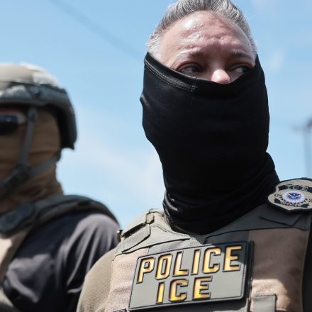 NEWARK, NEW JERSEY - MAY 26: ICE agents stand guard in front of protesters outside Delaney Hall which is being used as an Immigration and Customs Enforcement detention centeron May 26, 2026 in Newark, New Jersey. The protests, which have become tense over the holiday weekend, come amid reports of an ongoing hunger strike by detainees. (Photo by Spencer Platt/Getty Images)