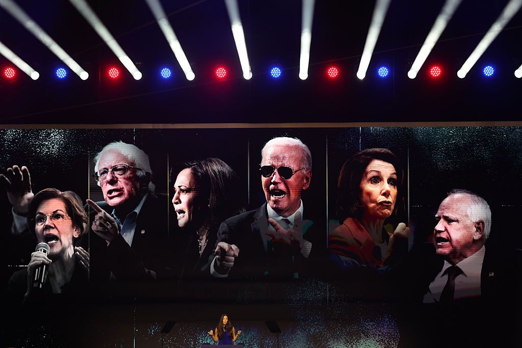 Images of Senator Elizabeth Warren, a Democrat from Massachusetts, Senator Bernie Sanders, an Independent from Vermont, former US Vice President Kamala Harris, former US President Joe Biden, Representative Nancy Pelosi, a Democrat from California, and Tim Walz, governor of Minnesota, are displayed as Ally Raskin, former Democrat and America First Grassroots leader, speaks during the first day of the Republican Midterm Convention at the American Airlines Center in Dallas, Texas, US, on Wednesday, Sept. 9, 2026. November's midterm elections will hinge in large part on Americans' attitudes toward the cost of living, and the polls show the public giving the president poor marks for his handling of the economy. Photographer: Mark Felix/Bloomberg via Getty Images