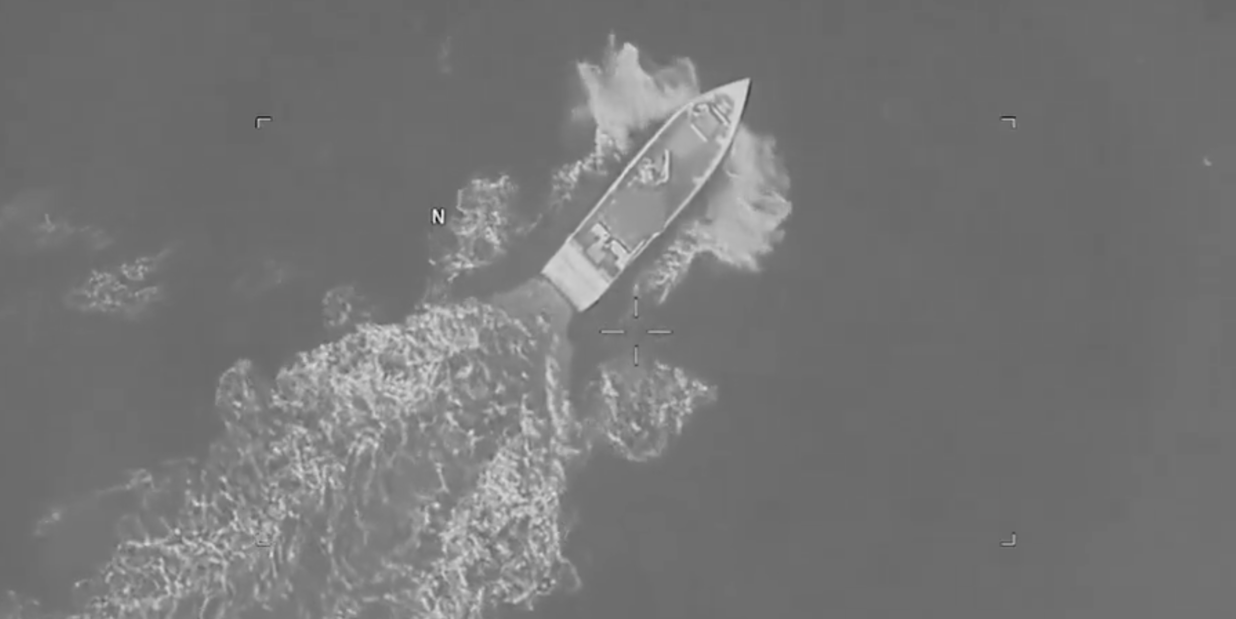 A social media post by U.S. Southern Command on Aug. 25, 2026, shows a vessel in the Caribbean, moments before a U.S. strike kills 4 people.