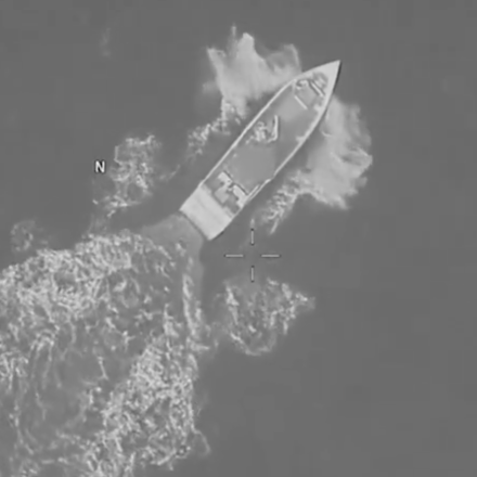 A social media post by U.S. Southern Command on Aug. 25, 2026, shows a vessel in the Caribbean, moments before a U.S. strike kills 4 people.