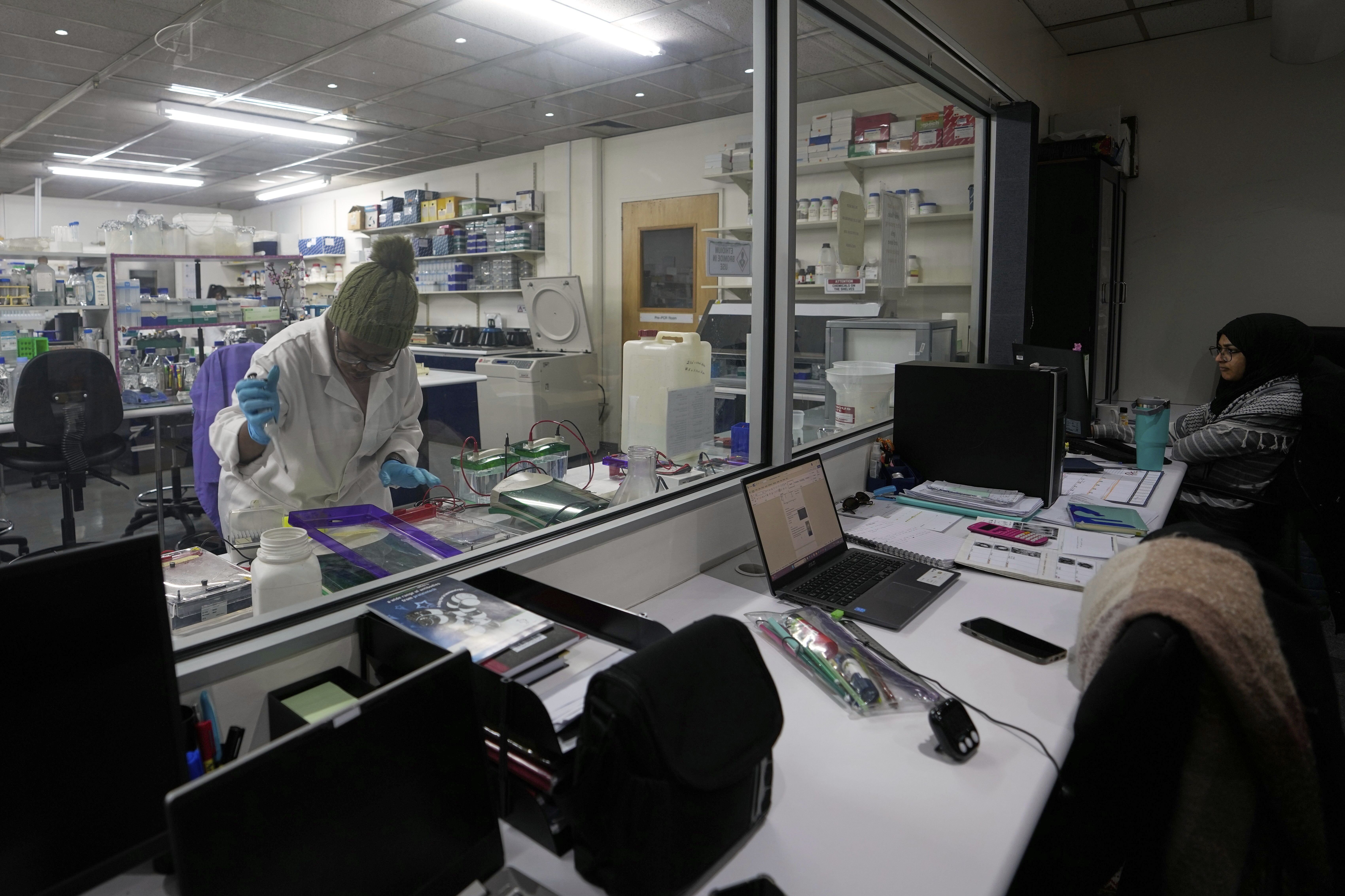 A laboratory technician Nozipho Mlotshwa works on samples at the Wits laboratory Antiviral Gene Therapy Research Unit, at University of the Witwatersrand Medical School, in Johannesburg, South Africa, Thursday, May 22, 2025. (AP Photo/Themba Hadebe)