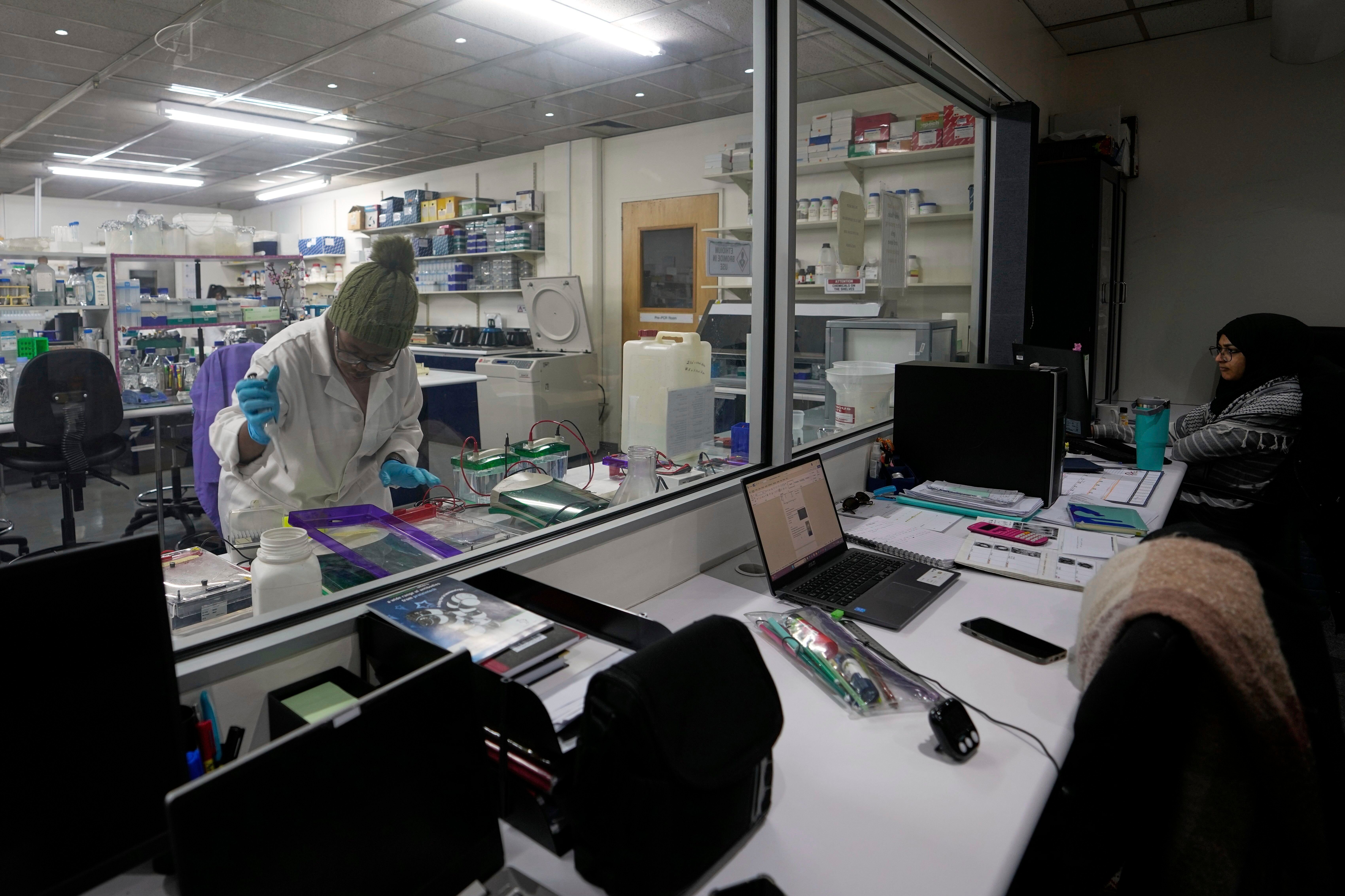 A laboratory technician Nozipho Mlotshwa works on samples at the Wits laboratory Antiviral Gene Therapy Research Unit, at University of the Witwatersrand Medical School, in Johannesburg, South Africa, Thursday, May 22, 2025. (AP Photo/Themba Hadebe)