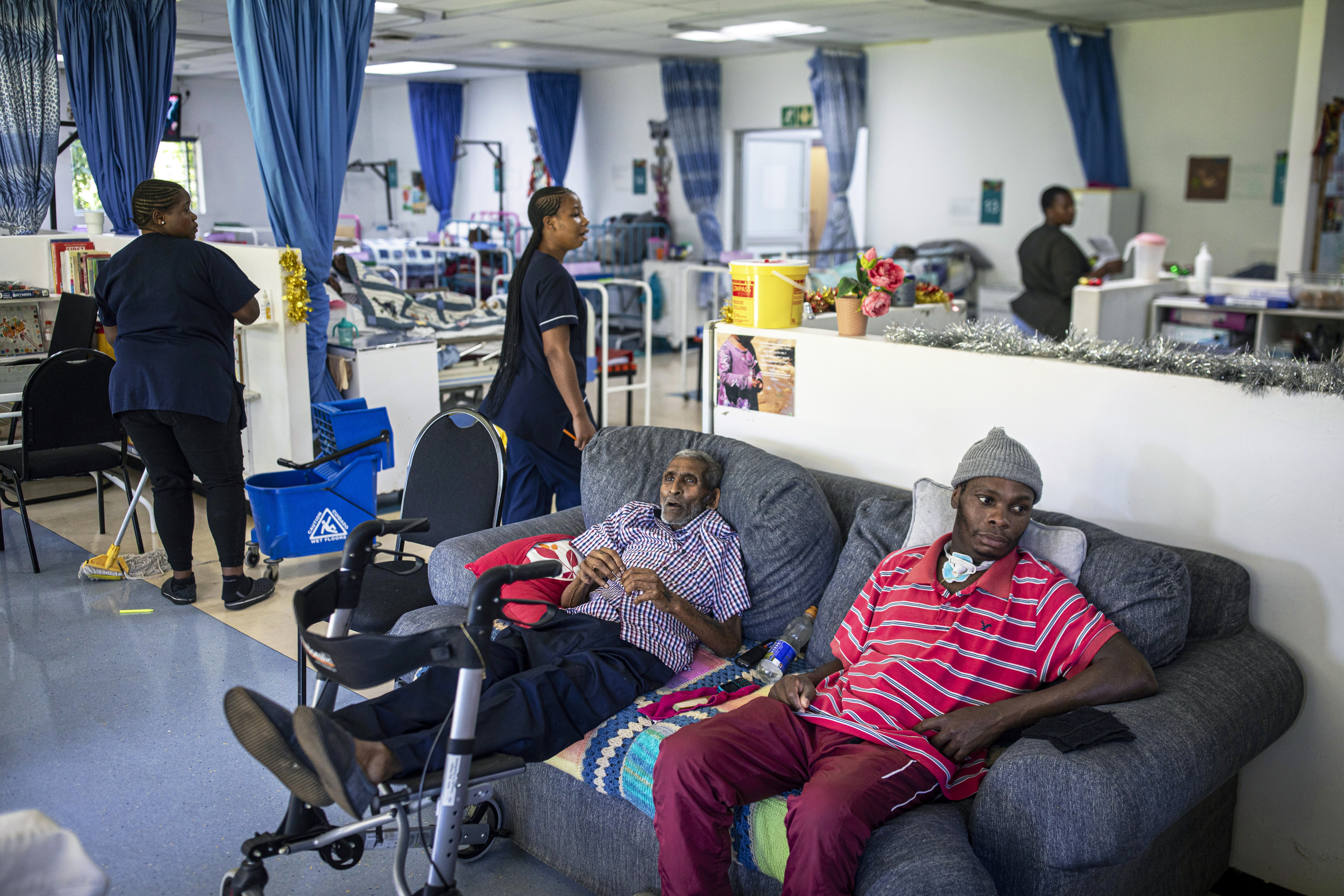  Patients watch a soccer game on TV in the hospice at Hillcrest AIDS Centre on November 29, 2025 in Hillcrest outside Durban, South Africa. The organization, founded in 1990, runs multiple projects in rural areas, educating and counseling teenagers and grandmothers about HIV and Gender Based Violence. About 8 million people live with HIV in South Africa, the largest HIV epidemic in the world. The country is battling with funding due to Aid cuts from the U.S. and many organizations has cut down their projects or closed completely. (Photo by Per-Anders Pettersson/Getty Images)